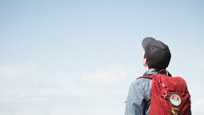 man staring at white sky taken at daytime